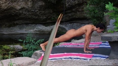 Naked MILF makes her body more flexible