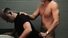 Horny gay stud has a sexy young guy banging his ass in the toilet