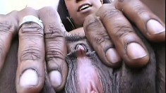 Horny black bitch goes solo into her dark pussy's amazing folds