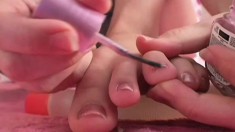 Anna does her toenails to get ready for a footjob she's going to give