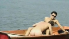 Two gorgeous gay studs satisfying their desires and needs on a boat